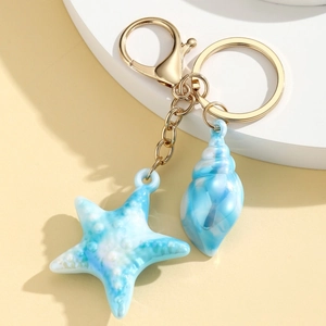 Kreativer Schlüsselanhänger mit Seestern und Muschel aus Harz, blauem Marmoreffekt und Gold