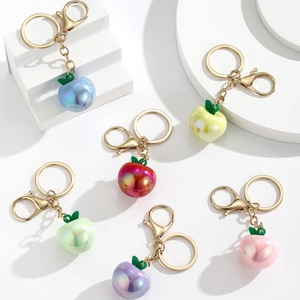 Set of 6 colorful resin apple keychains with pearlescent finish and gold hardware
