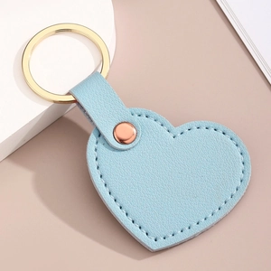 Porte-clés Cœur en Cuir PU Double Face Avec Anneau en Métal Doré et Coutures Pendentif de Sac Coloré pour Femmes Hommes Cadeaux