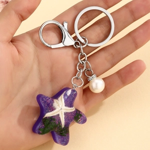 Cute purple resin starfish keychain with white pearl charm and silver lobster clasp