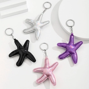 Portachiavi a stella marina in pelle colorata bianco laser, nero, rosa e viola con anelli