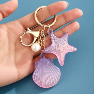 Détails du porte-clés étoile de mer et coquillage dégradé avec perle et fermoir doré
