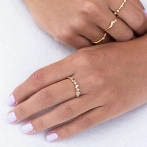 Elegant 18k gold plated ring set with irregular cubic zirconia on model's hand