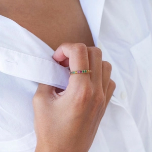 Chic gold plated rainbow eternity ring with colorful zircon stones on model's hand