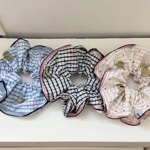 Three-pack elastic hair scrunchies with plaid and cartoon puppy prints in soft fabric