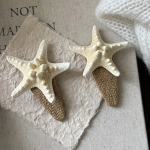 Set of starfish straw hair clips in creamy white for beach vacation and summer hair styling