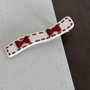 Sweet cream hair clip with red polka dots and 3D bowknot details for women