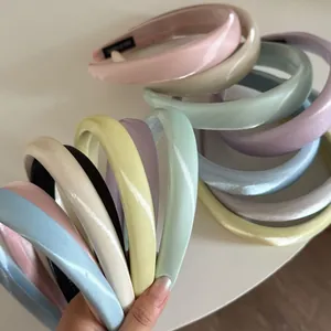 Detail of multi-colored padded satin headbands with soft silk texture and high volume design