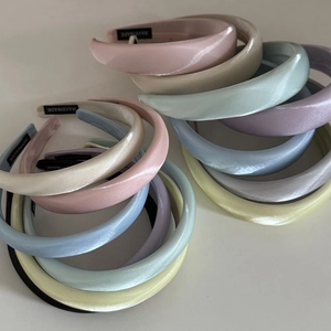 Chic padded satin headbands for women in assorted macaron colors with handmade label