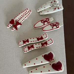 Elegant set of beige hair clips with red heart polka dots and bow patterns for women