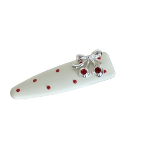 Korean style red polka dot hair clip with cherry bow accent on white background