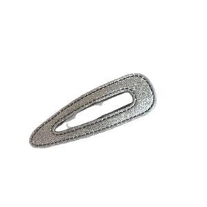 Sparkly silver sequin oval hair clip with fine stitching and classic teardrop design