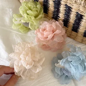 Elegant chiffon flower hair claw clips in pastel green, pink, cream, and blue colors