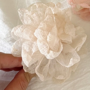 Elegant off-white chiffon flower hair claw clip with layered petals and soft texture
