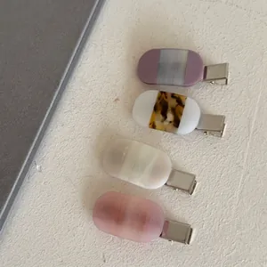 French acetate hair clip set with purple, leopard, and striped patterns for women
