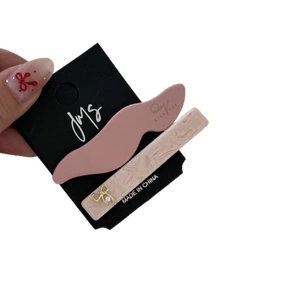 Set di fermagli per capelli in acetato con clip rosa ondulata e clip beige con fiocco d'oro