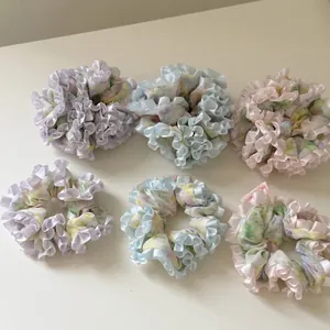 6-piece set of floral ruffle scrunchies in pink and blue pastel chiffon fabric