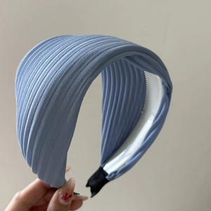 Light blue pleated wide headband with anti-slip design and minimalist striped fabric style