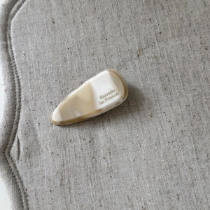 Chic acetate teardrop barrette in beige marble texture for women elegant hair styling