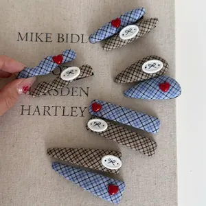 Blue and brown plaid heart hair clips set with fabric texture and elegant retro style