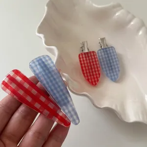 Classic blue and red plaid hair clips set with translucent design and metal duckbill grip