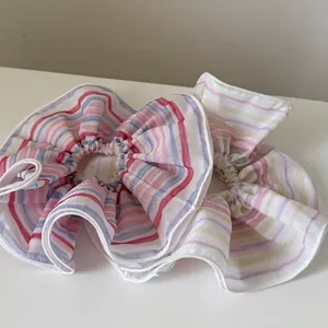 Rainbow striped fabric scrunchies set for elegant ponytail styling and hair buns