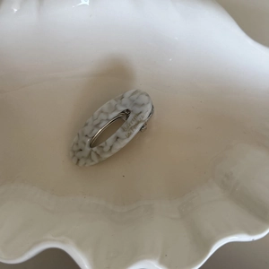French vintage oval hollow acetate hair clip with marble pattern and gold lettering