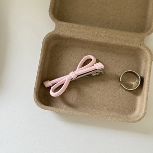 Pink polka dot bow hair clip and silver ring set in a rustic kraft gift box