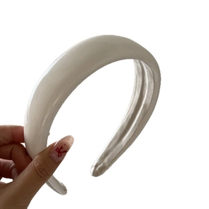 Classic white padded sponge headband with glossy finish for high top hair styling