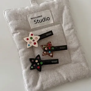 Star shaped acetate hair clips with colorful rhinestones in white, brown leopard and black