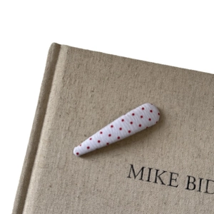 Vintage white hair clip with red polka dots in fabric-wrapped teardrop shape