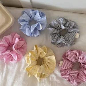Set of 5 striped donut hair scrunchies in pastel colors with Hand Made label