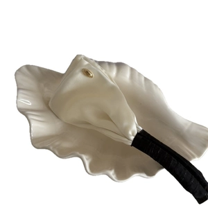 Elegant satin polka dot bow banana clip for women featuring classic black and white contrast