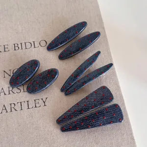 Blue denim texture hair clip set with red polka dots in teardrop and oval shapes