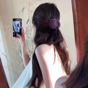 Elegant deep purple satin rose flower hair claw clip for women on long wavy hair