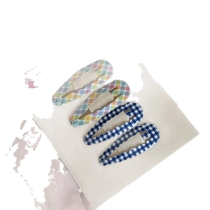 Set of four colorful plaid and navy checkered snap hair clips for girls and women
