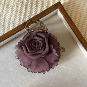 Elegant purple rose hair claw clip made of fabric and resin for sophisticated hair styling