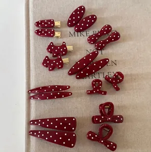 Retro cherry red polka dot hair clips in various shapes like bows and dogs for women