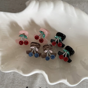 Set of six French vintage cherry hair claws with colorful rhinestones in a white tray