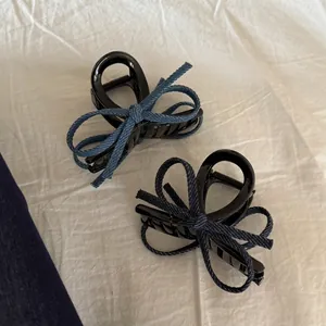 Set of two vintage denim bow hair claws in light and dark blue resin finish