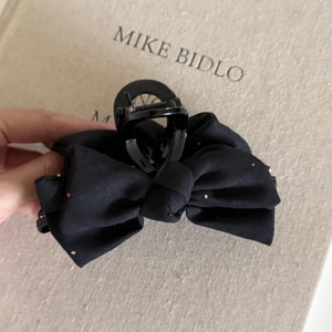 Large black denim bow hair claw clip with subtle glitter details for elegant updos