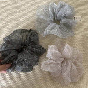 Three-piece set of silver cloud seersucker scrunchies with glitter rhinestones and brand tag