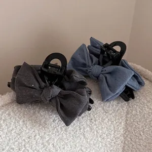 Denim bow hair claw clips set in navy blue and dark grey for elegant updos