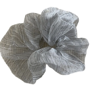 Elegant silver oversized scrunchie with stripe texture and sparkling rhinestones