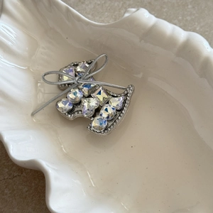 Sparkling rhinestone star dog hair clip with silver bow and crystal embellishments