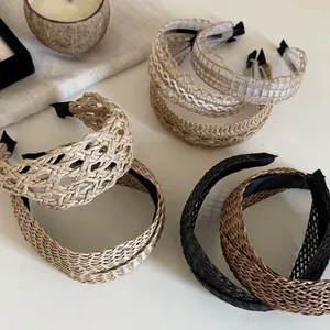 Close-up of Bohemian woven straw headbands with detailed textures and natural fabric lining