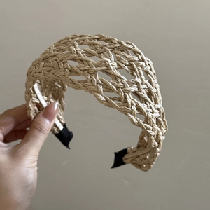 Bohemian woven straw wide headband for women in beige with elegant crisscross pattern texture