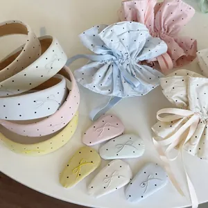Polka dot hair accessory set with headband, bow hair clips and pouch in pastel colors