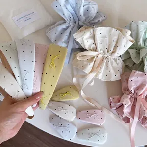 Polka dot headband set with bow hair clips and matching drawstring storage pouch