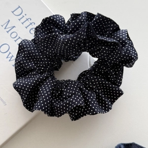 Chic black polka dot scrunchie with white patterns for high ponytail hairstyles